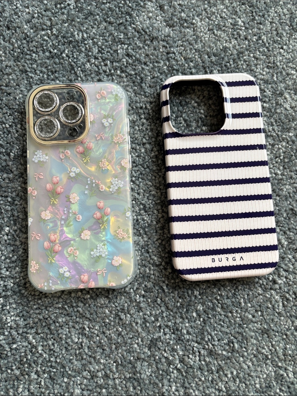 Two iPhone cases.  Navy & white Stripe, and Pastel Floral on White background